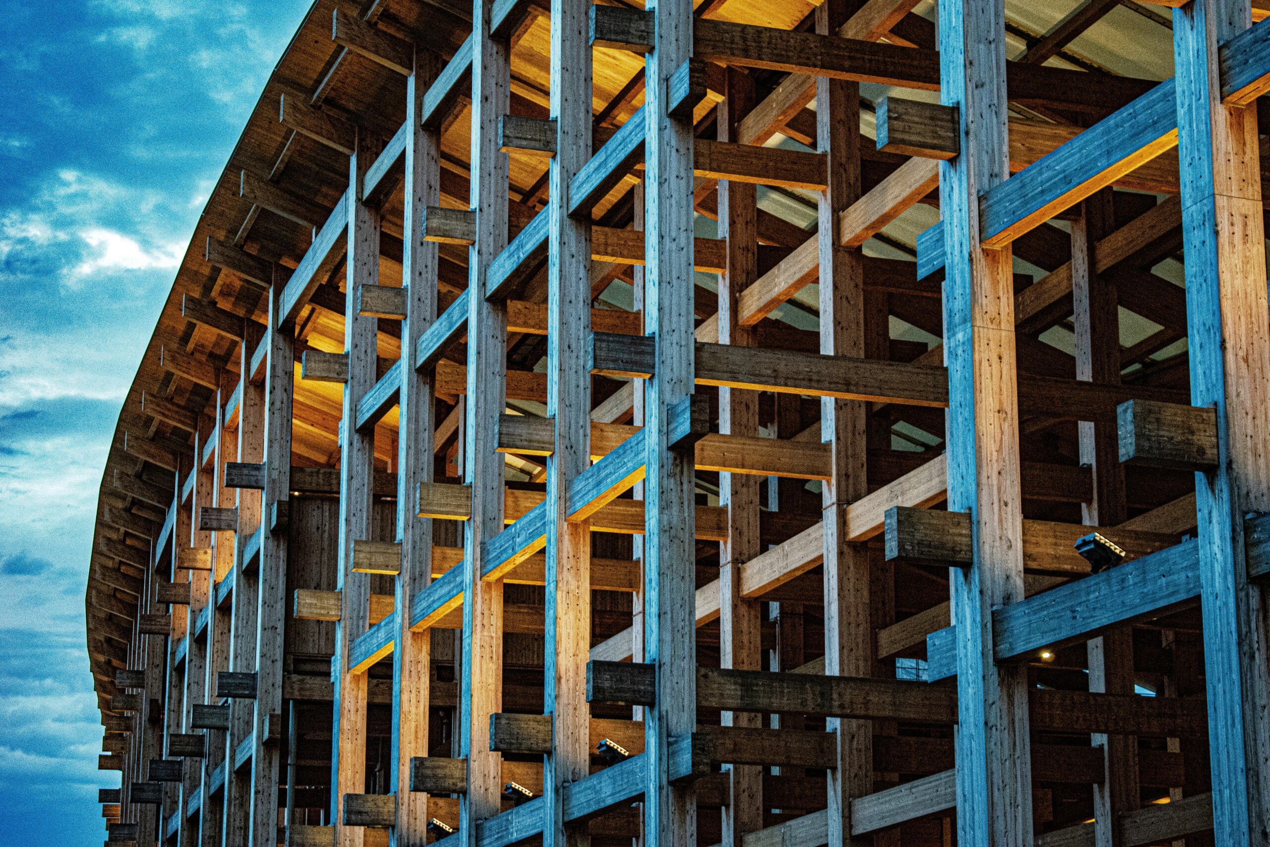 Intricate wooden structural framework of a modern building, illustrating the complex design work protected by architect professional liability insurance