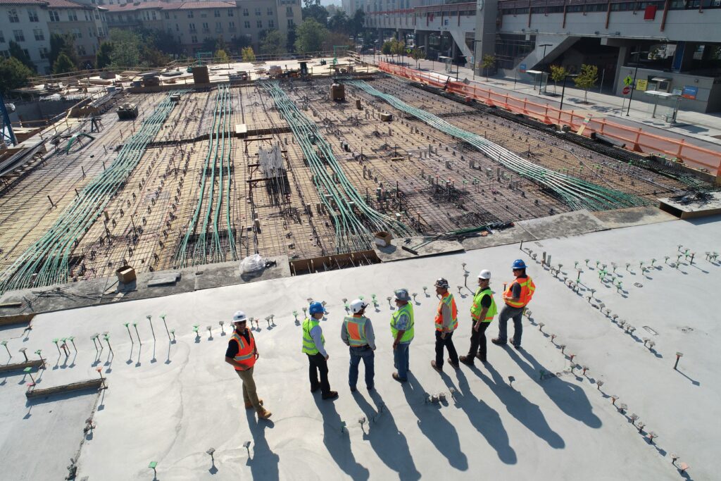 Engineers and construction professionals inspecting a building site representing liability insurance for engineers and professional risk protection