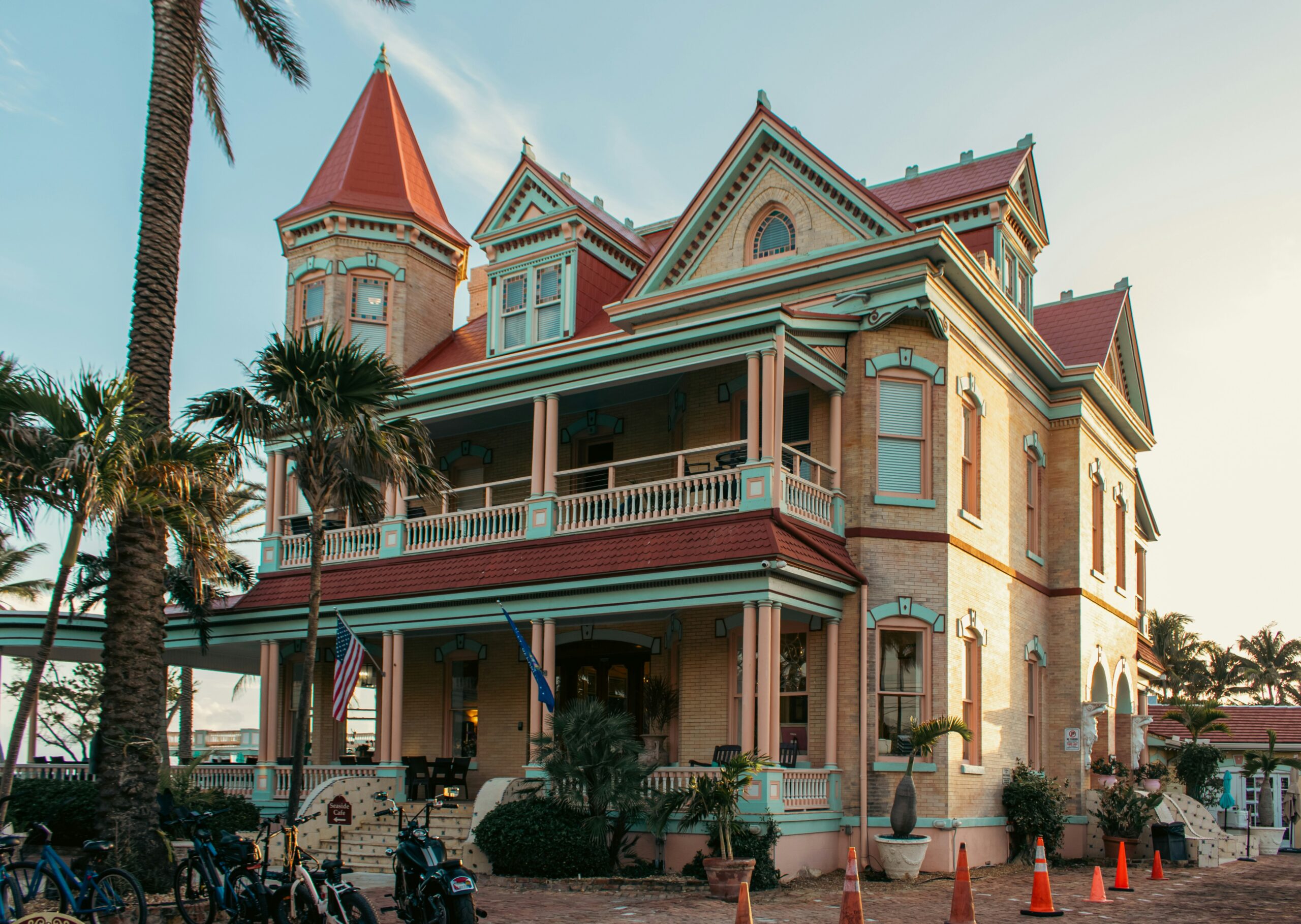 Historic Florida Victorian architecture with red roof and palm trees representing businesses needing professional liability insurance Florida.