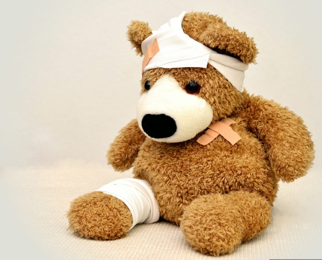 Injured teddy bear with bandages symbolizing the need for therapist malpractice insurance and professional liability protection