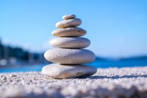 Therapy liability insurance concept with balanced stones representing professional protection Malpractice insurance for therapists symbolized by stable stacked stones