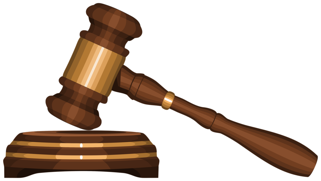 A wooden judge’s gavel and sound block representing legal law and attorney malpractice insurance regulations, isolated on a black background.